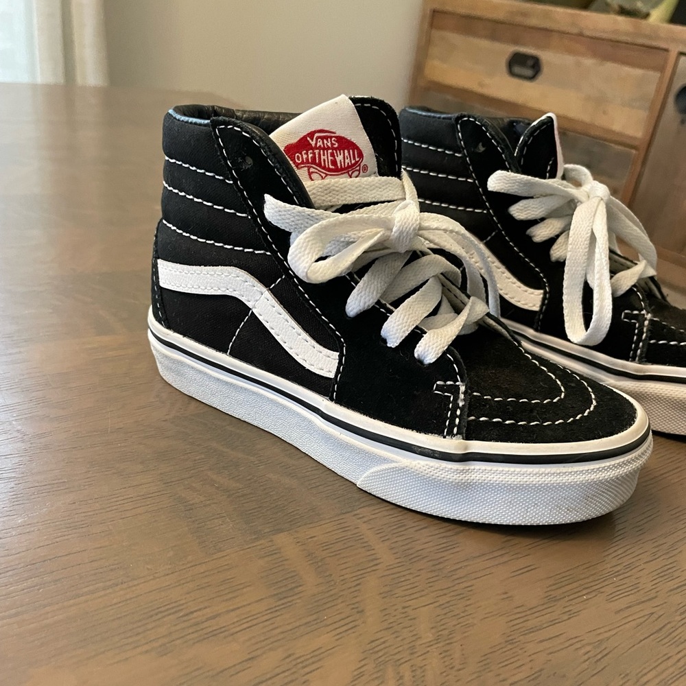 Brand new kid’s high top Vans. Size 11. Never worn.